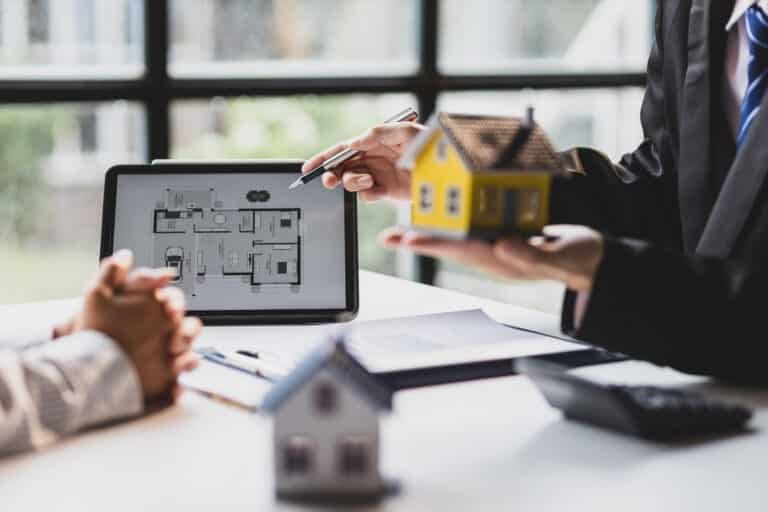 real estate meeting reviewing house plans with mod 2026 01 09 11 35 35 utc