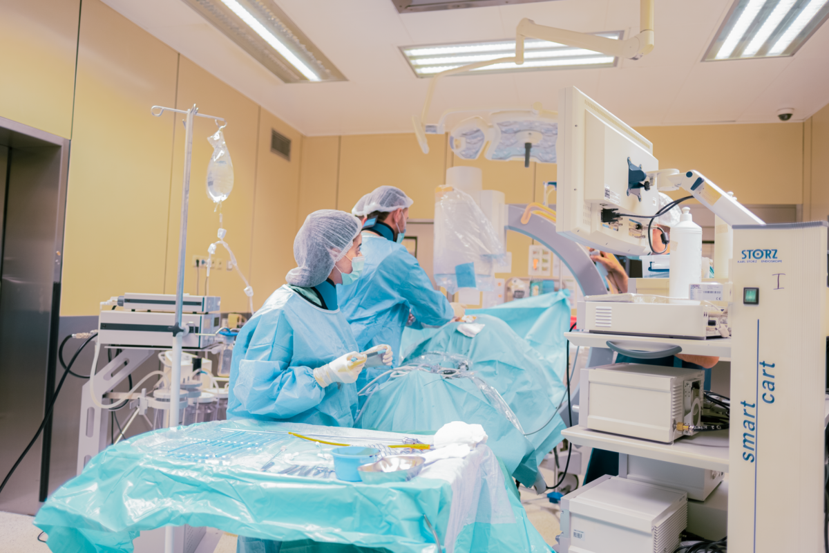 Urology team in an operating room preparing a ureteral stent placement procedure