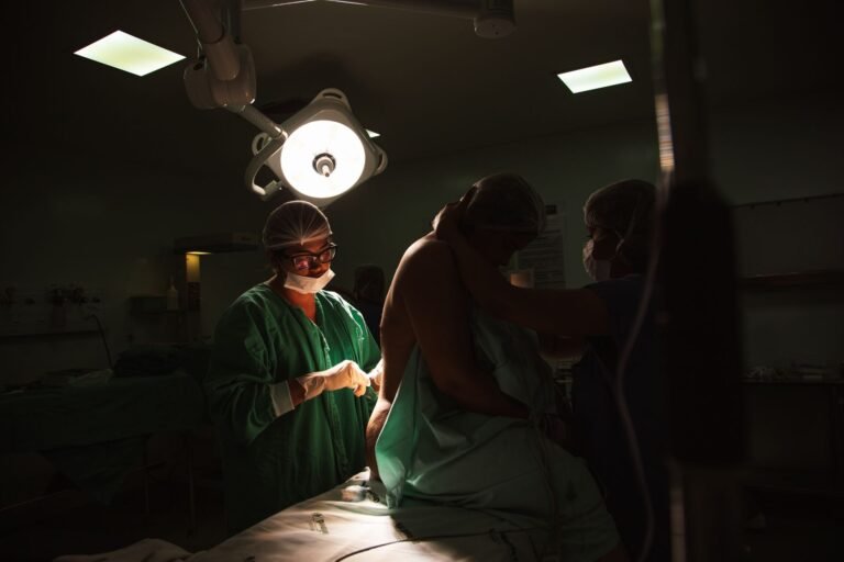 Surgical team performing percutaneous nephrolithotomy where a nephrostomy dilator set is used
