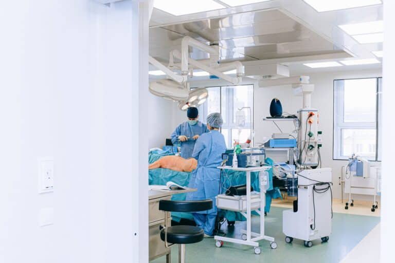 Surgical team performing ureteroscopy where a stone retrieval basket is used