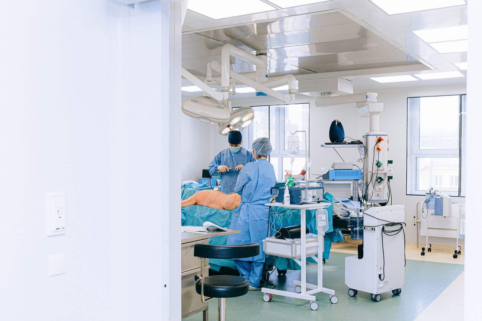 Surgical team performing ureteroscopy where a stone retrieval basket is used